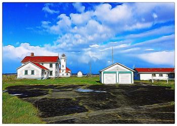 View of buildings against cloudy sky