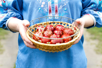 Midsection of woman holding food