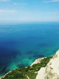 High angle view of sea against blue sky