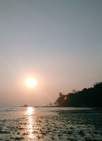 Scenic view of sea against clear sky during sunset