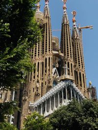 Low angle view of sagrada familia in city