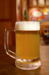 Close-up of beer glass on table