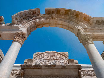 Low angle view of historical building against blue sky