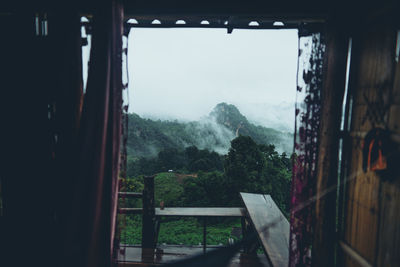 Scenic view of mountains seen through window