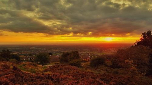 Scenic view of landscape against cloudy sky