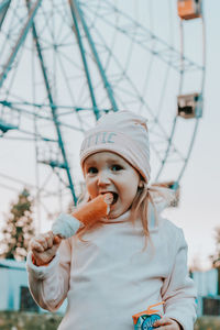 Portrait of cute girl holding camera