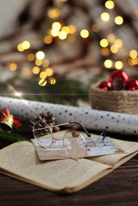 Close-up of illuminated christmas tree on table