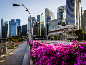 Street amidst buildings in city against clear sky