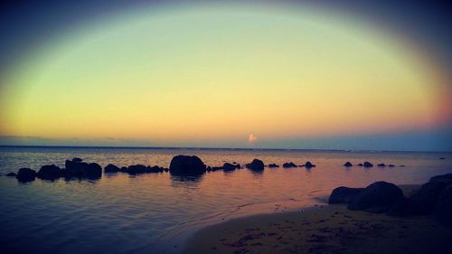 Scenic view of sea at sunset