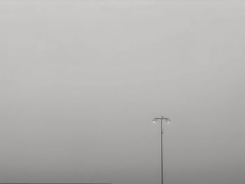 Low angle view of street light against clear sky