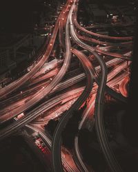 High angle view of light trails on road at night