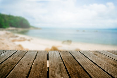 Wood on beach against sky