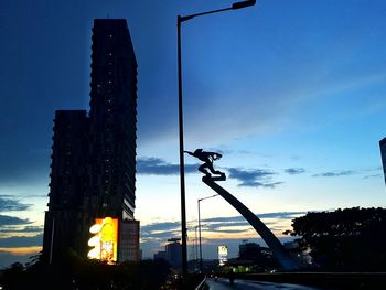 Low angle view of silhouette trees against sky at sunset