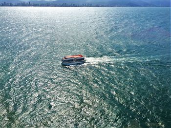 High angle view of boat sailing on sea