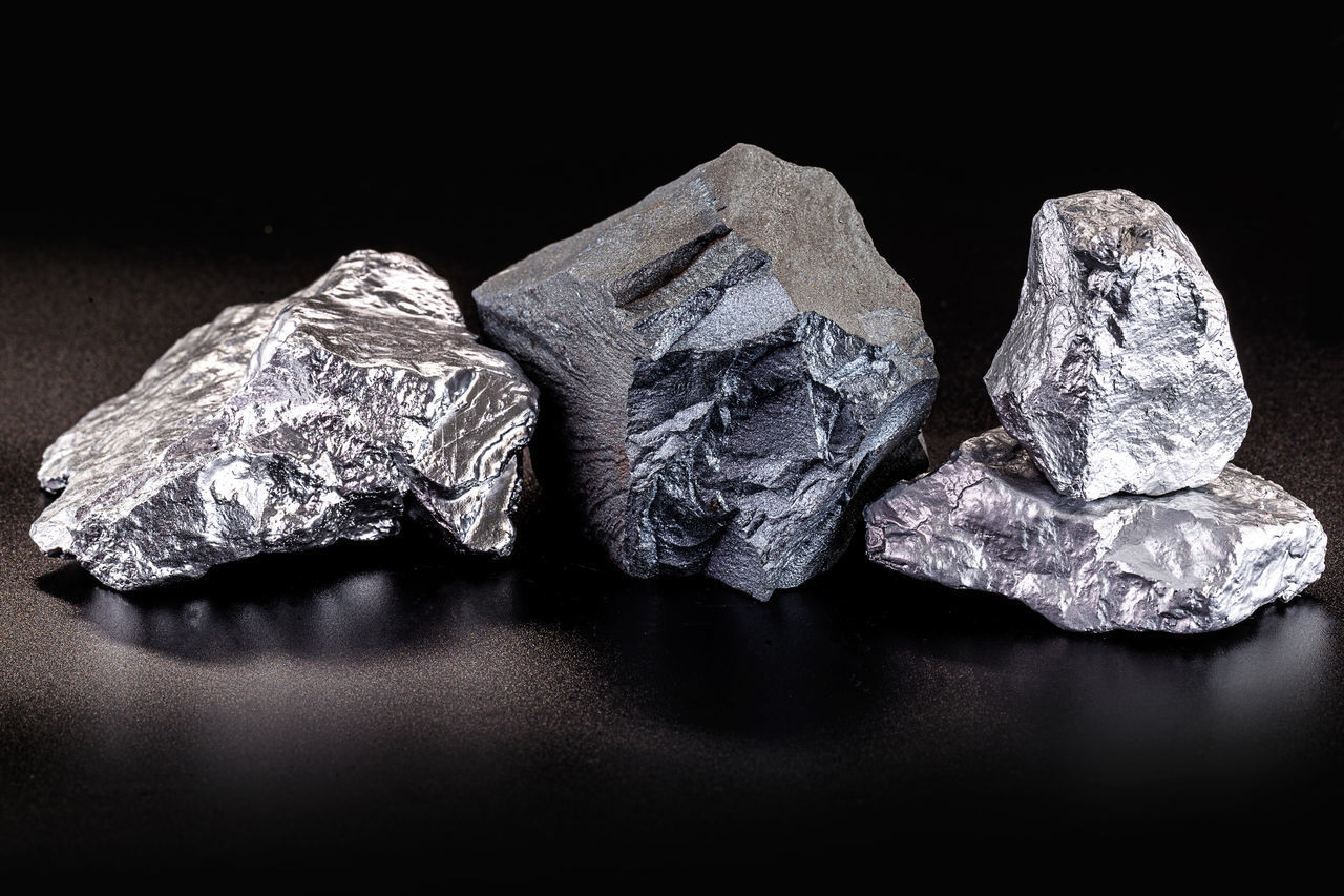 CLOSE-UP OF ROCKS ON TABLE AGAINST ROCK