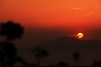 Scenic view of silhouette landscape against romantic sky at sunset