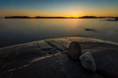 Scenic view of lake at sunset