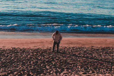 Rear view of woman on beach