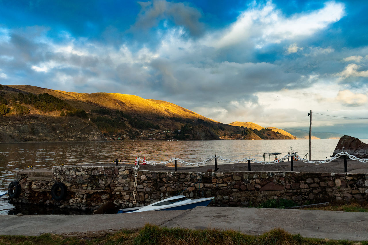 cloud - sky, sky, water, mountain, beauty in nature, scenics - nature, nature, sea, tranquil scene, day, architecture, non-urban scene, tranquility, no people, built structure, flag, idyllic, outdoors