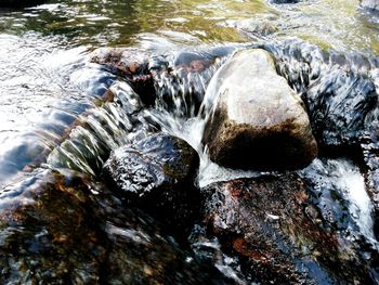 Close-up of rocks in river