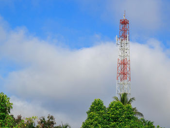 Antenna and cellular tower in blue sky background