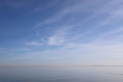 Scenic view of sea against blue sky