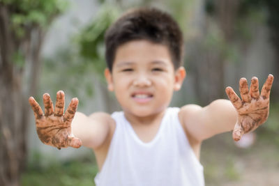 Portrait of cute boy in park