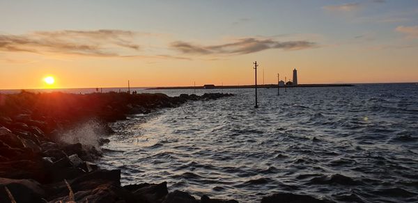 Scenic view of sea against sky during sunset