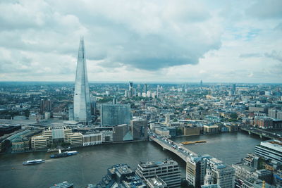 Cityscape against cloudy sky