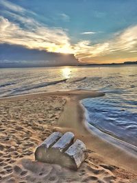 Scenic view of beach against sky during sunset