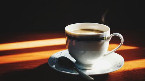 Close-up of coffee cup on table