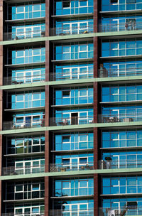 Multiple windows on a large apartment building