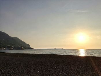Scenic view of sea against sky at sunset