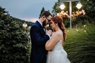 Rear view of couple holding hands