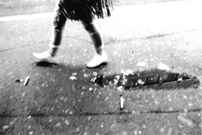 Blurred motion of person walking on road