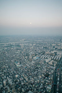 Aerial view of cityscape against sky