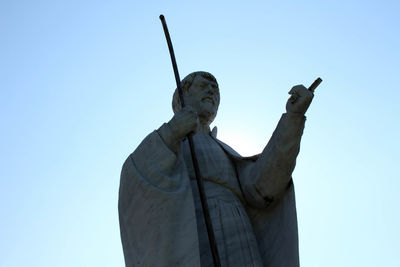 Low angle view of statue against sky