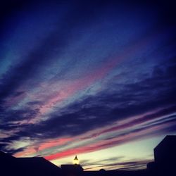 Low angle view of cloudy sky at sunset