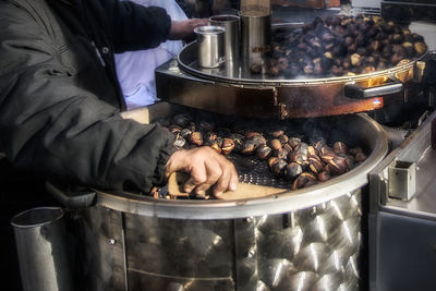 Midsection of man preparing food