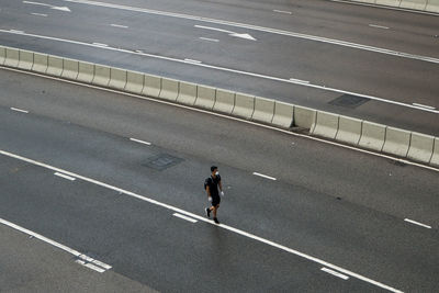 High angle view of man running on road