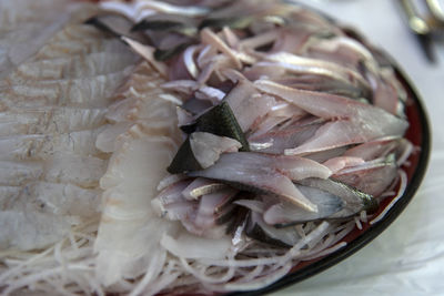 High angle view of chopped fish in plate