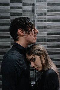 Couple taking shower in bathroom