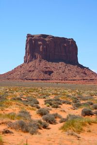 Scenic view of mountains against blue sky