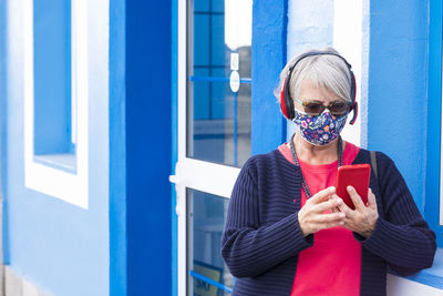 Mid adult man using mobile phone