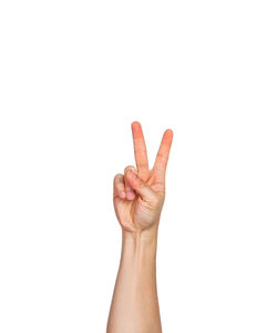 Close-up of human hand against white background