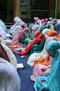 Large group of women praying