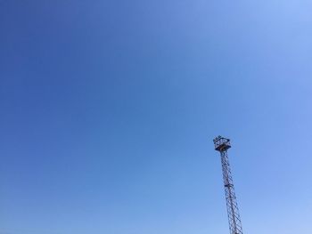 Low angle view of floodlight against clear blue sky