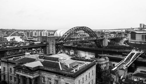 Tyne bridge over river against clear sky in city