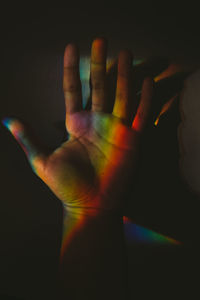 Close-up of cropped hand against white background