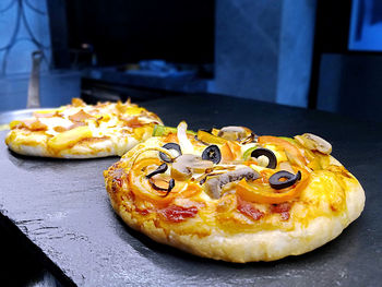 Close-up of mini pizza on table